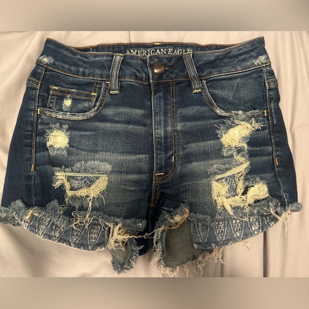 Dark denim shorts with blue lace paisley pockets